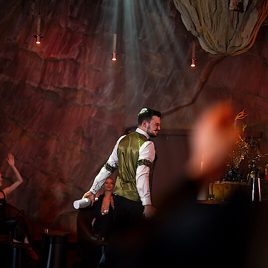 Bartender Eatrenalin Late Night Bartender at Eatrenalin Late Night. Guests around him.